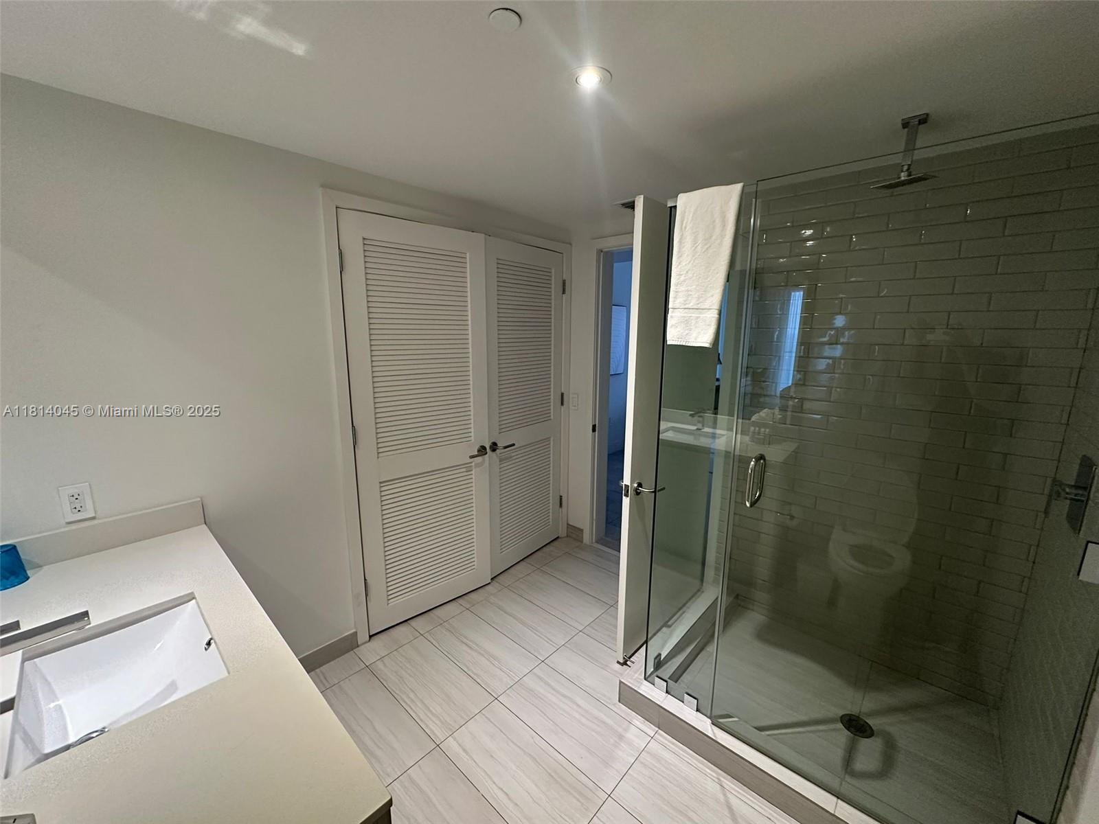 4010 South Ocean Drive, Unit R1507 Hollywood, FL 33019 - Photo 10 of 14 a bathroom with a shower and toilet
