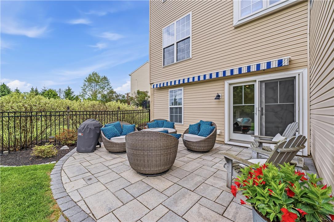 9031 Pathfinder Road Breinigsville, PA 18031 - Photo 54 of 63 A private paved patio offers an ideal space for outdoor relaxation and entertaining.