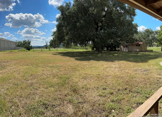 a big yard with trees