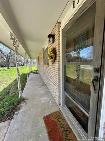 a porch with wooden floor