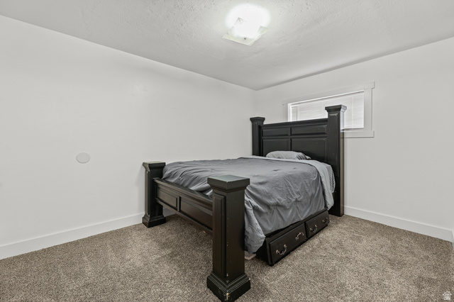 822 Pinewood Circle Price, UT 84501 - Photo 24 of 49 Carpeted room with white walls, a single window with blinds, and white trim