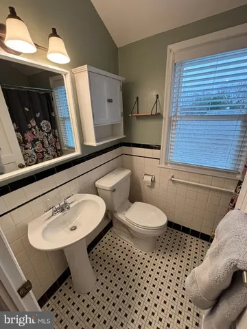 a bed room with a bed window and a couch