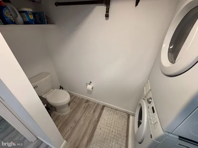 a bathroom with a shower and toilet