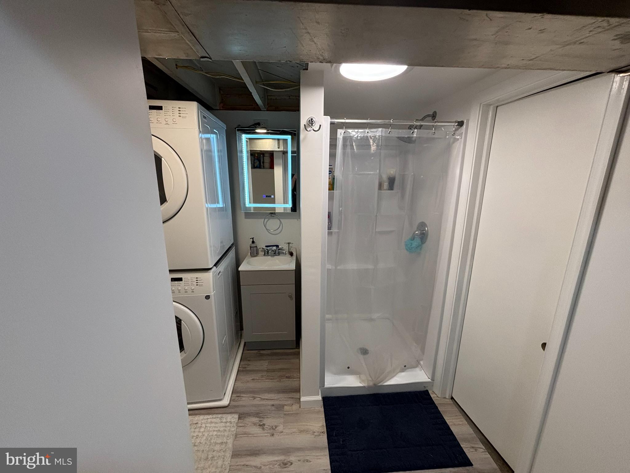 2803 Albemarle Drive Alexandria, VA 22303 - Photo 19 of 21 Modern laundry and shower space combined.