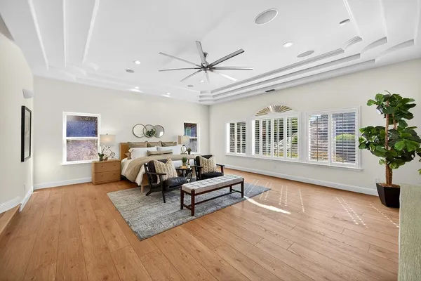 a living room with furniture window and wooden floor