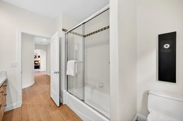 a view of a kitchen cabinets and wooden floor