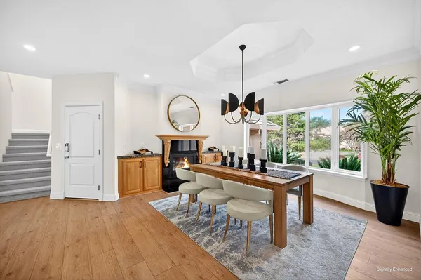 a living room with furniture a window and a clock
