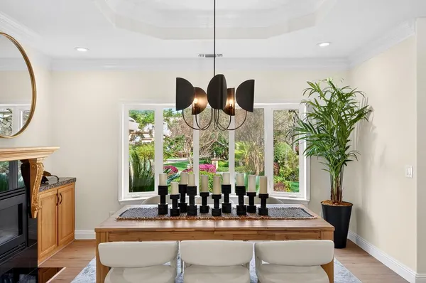 a view of dining room with furniture and wooden floor