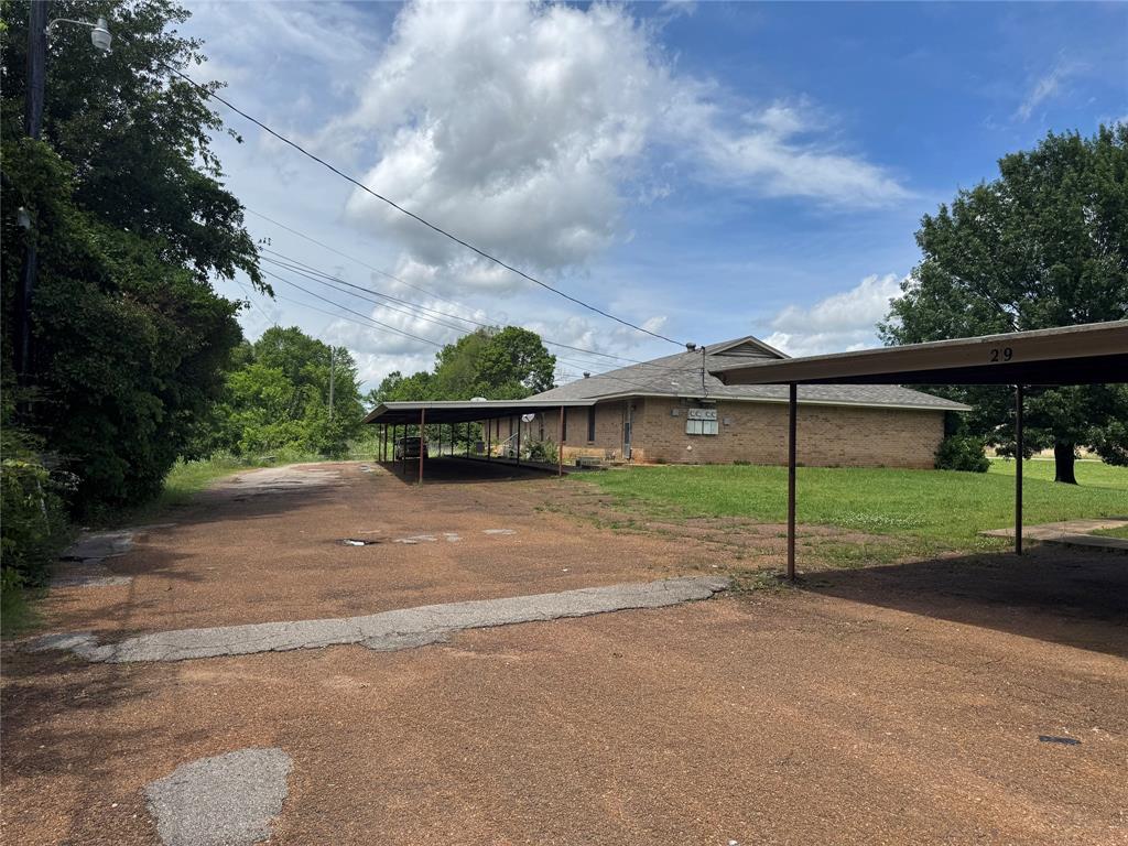 4515 Southeast Loop 286 Paris, TX 75460 - Photo 35 of 37 a view of a house with a yard and large tree