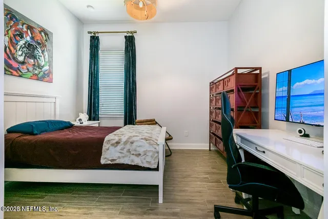 a bathroom with a tub shower sink and vanity