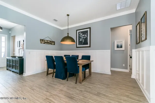 a kitchen with a sink stove and wooden cabinets
