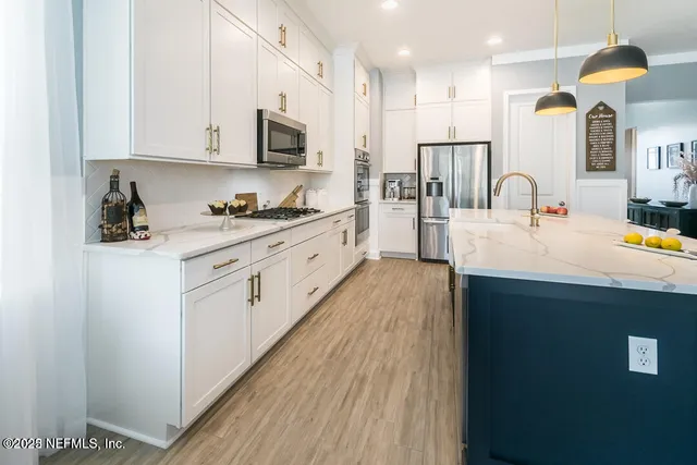 a view of kitchen and dining area with furniture