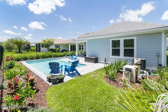 a view of swimming pool with seating space