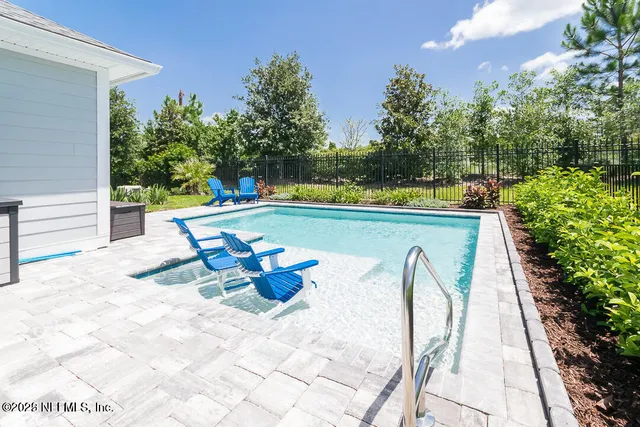 a view of a patio with couches and potted plants