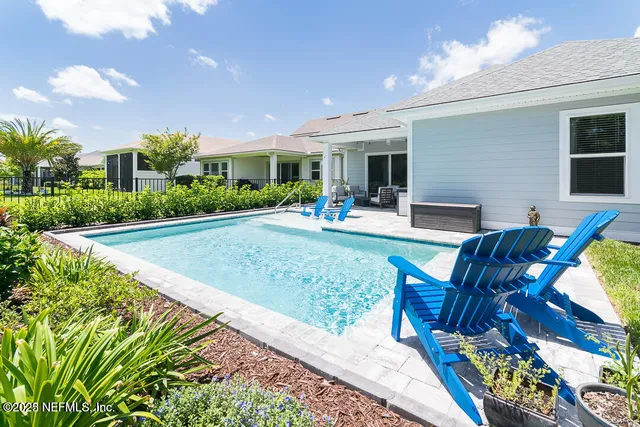 a front view of house with outdoor seating