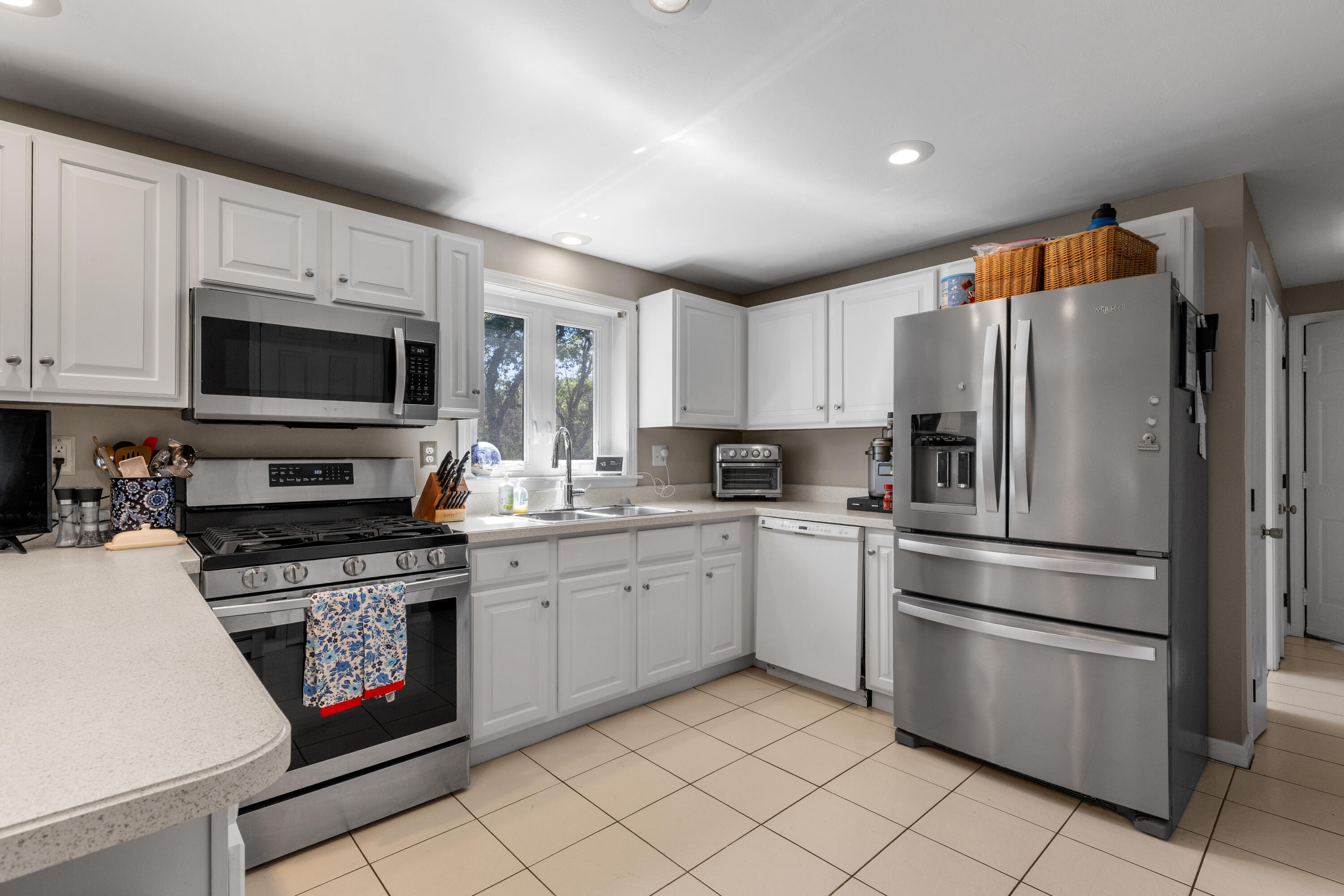 30 Sheffield Place Mashpee, MA 02649 - Photo 15 of 38 a kitchen with granite countertop stainless steel appliances and white cabinets