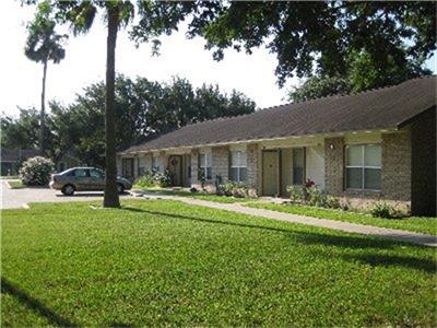 519 North Main Street Donna, TX 78537 - Photo 1 of 6 a front view of a house with garden and trees