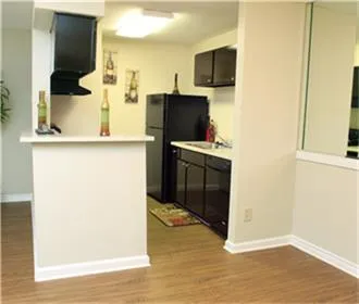 a view of a kitchen from the hallway
