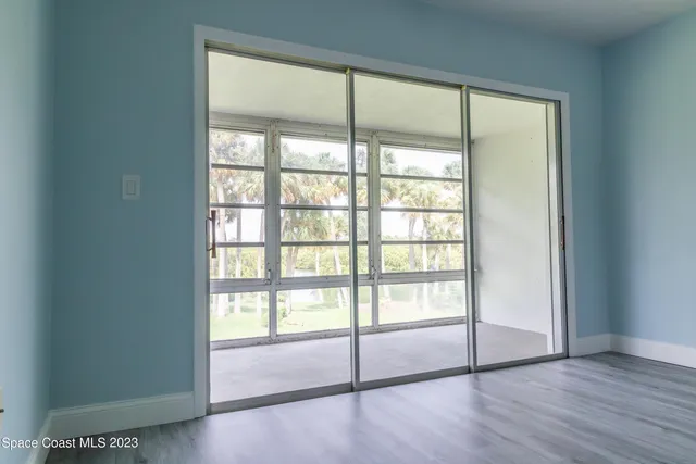 a view of an empty room with a large window