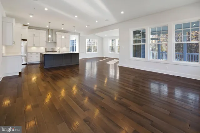 a view of kitchen with cabinets and wooden floor