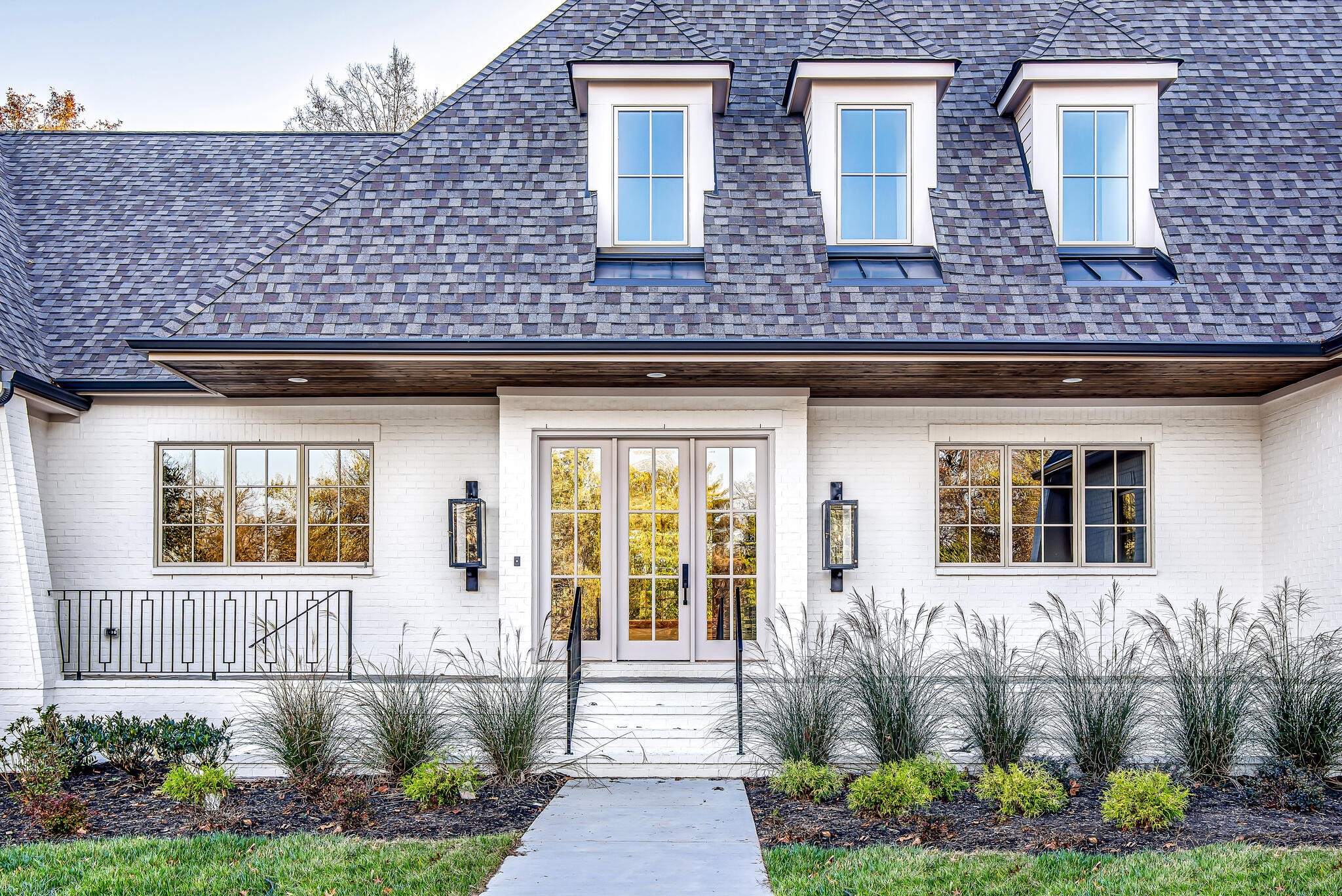 201 Olive Branch Road Nashville, TN 37205 - Photo 67 of 67 a front view of a house with a yard and potted plants