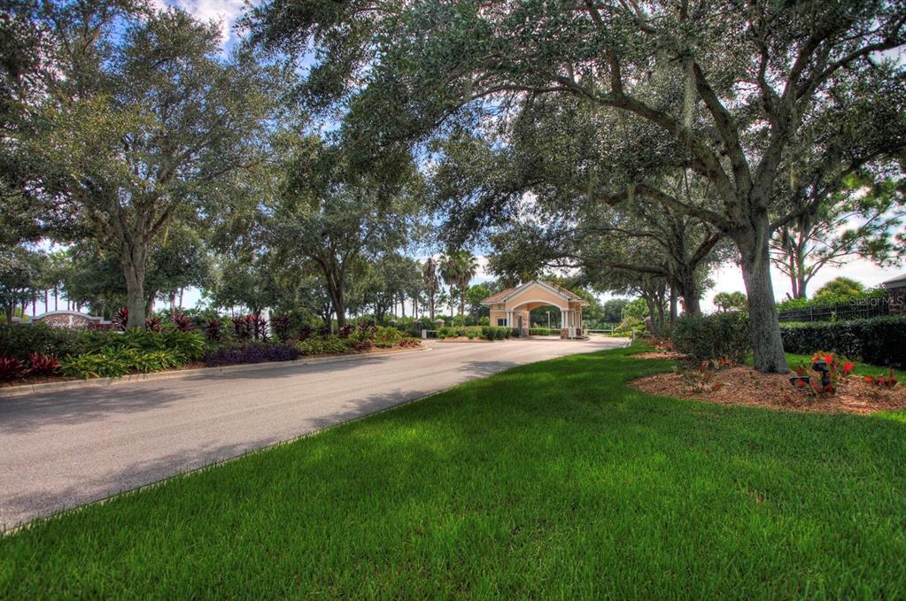 5301 Mahogany Run Avenue, Unit 1023 Sarasota, FL 34241 - Photo 2 of 56 a view of a park with large trees