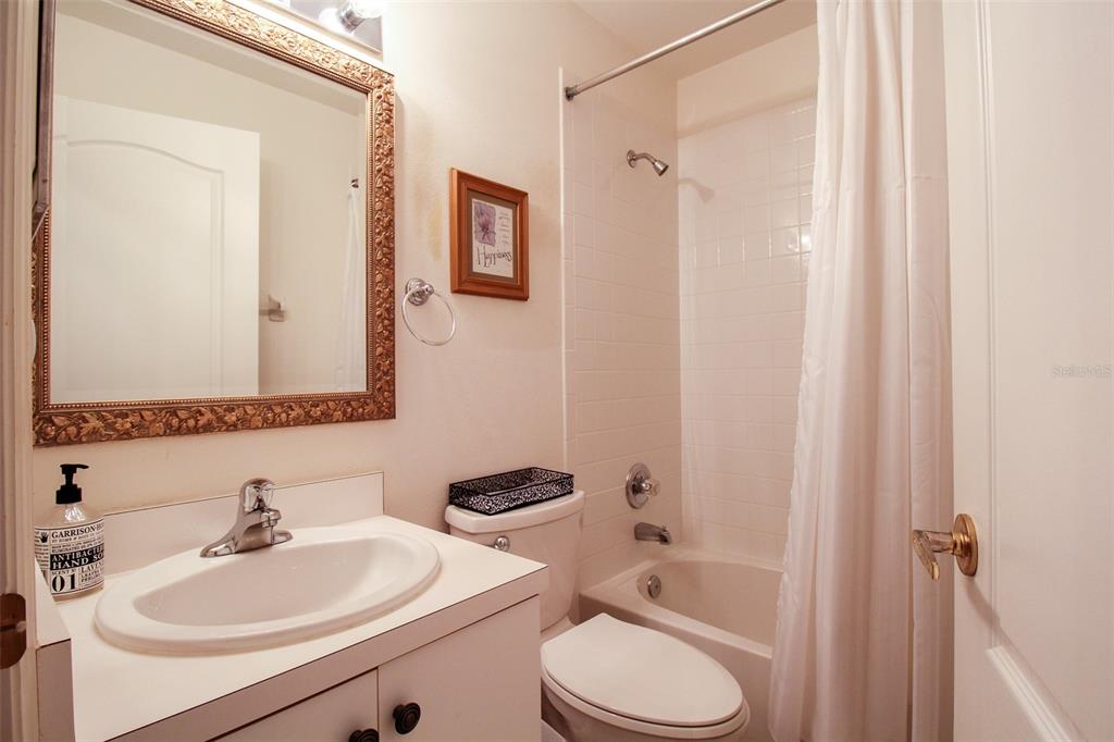 5301 Mahogany Run Avenue, Unit 1023 Sarasota, FL 34241 - Photo 26 of 56 a bathroom with a sink toilet and shower