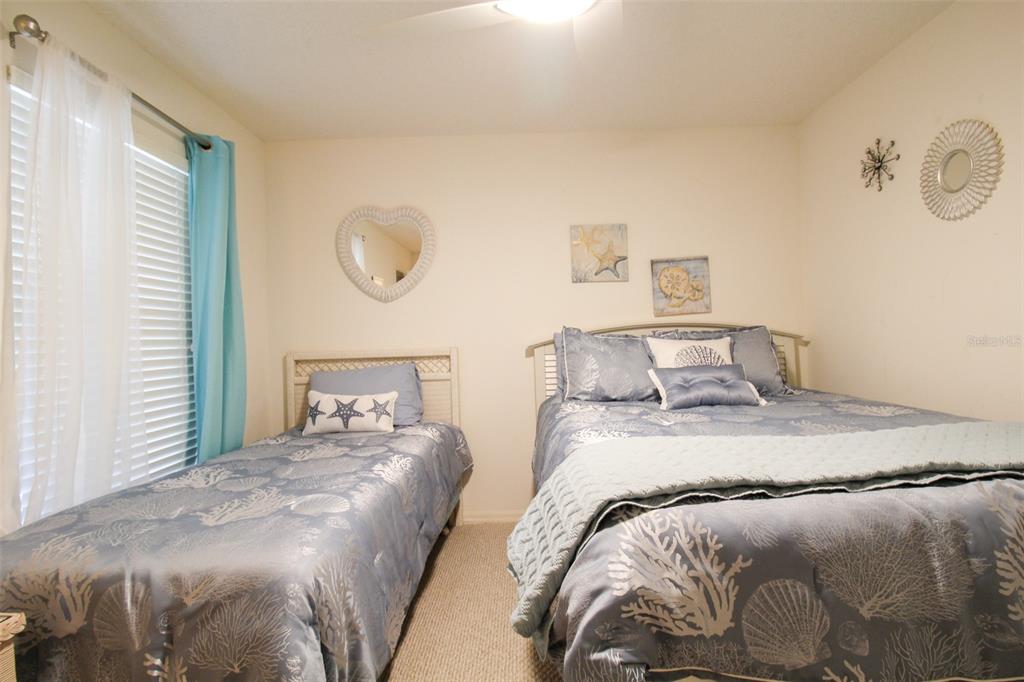 5301 Mahogany Run Avenue, Unit 1023 Sarasota, FL 34241 - Photo 28 of 56 a bedroom with a bed and window
