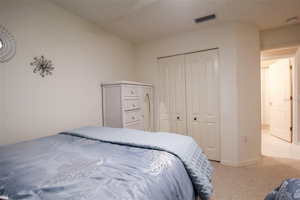 5301 Mahogany Run Avenue, Unit 1023 Sarasota, FL 34241 - Photo 29 of 56 a bedroom with a bed and a window