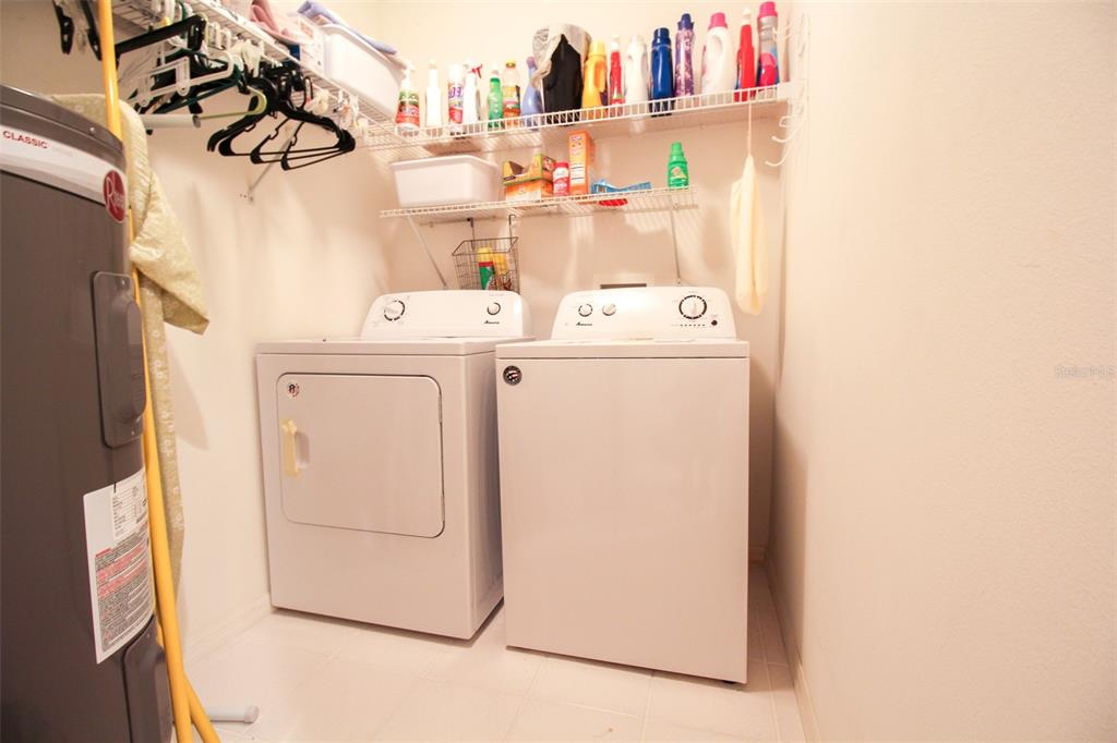 5301 Mahogany Run Avenue, Unit 1023 Sarasota, FL 34241 - Photo 31 of 56 a utility room with dryer and washer