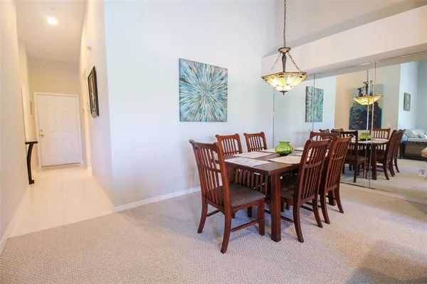 a kitchen with stainless steel appliances granite countertop a sink and a white cabinets