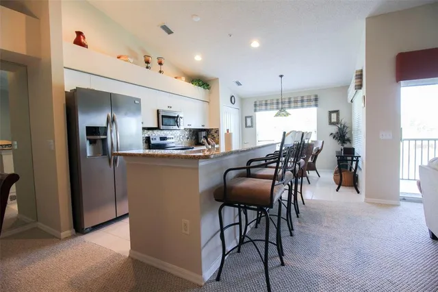 a bedroom with a bed and lamp