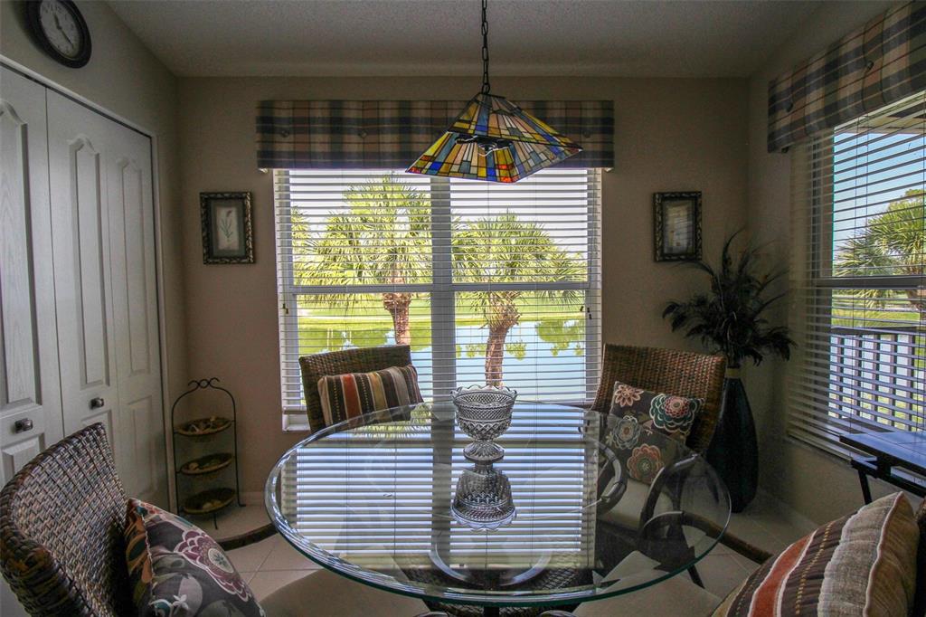 5301 Mahogany Run Avenue, Unit 1023 Sarasota, FL 34241 - Photo 41 of 56 a view of a livingroom with furniture window and wooden floor