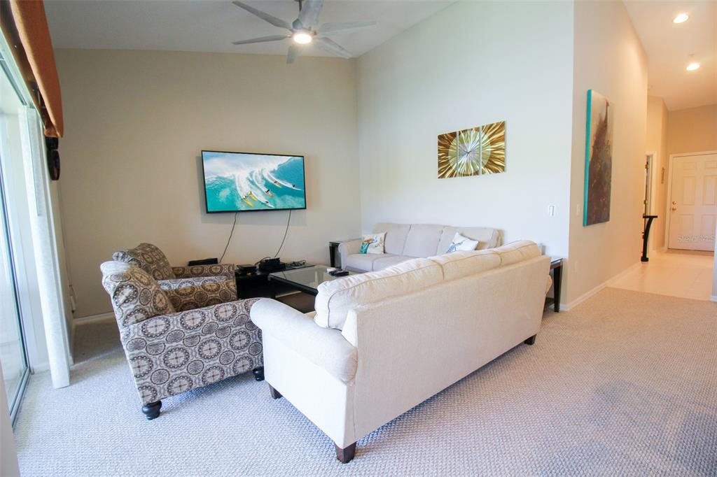 5301 Mahogany Run Avenue, Unit 1023 Sarasota, FL 34241 - Photo 44 of 56 a living room with furniture and a couch