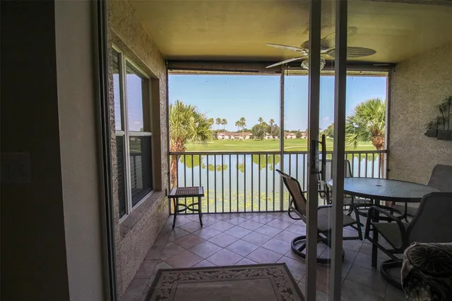 a view of a porch with a table and a chair