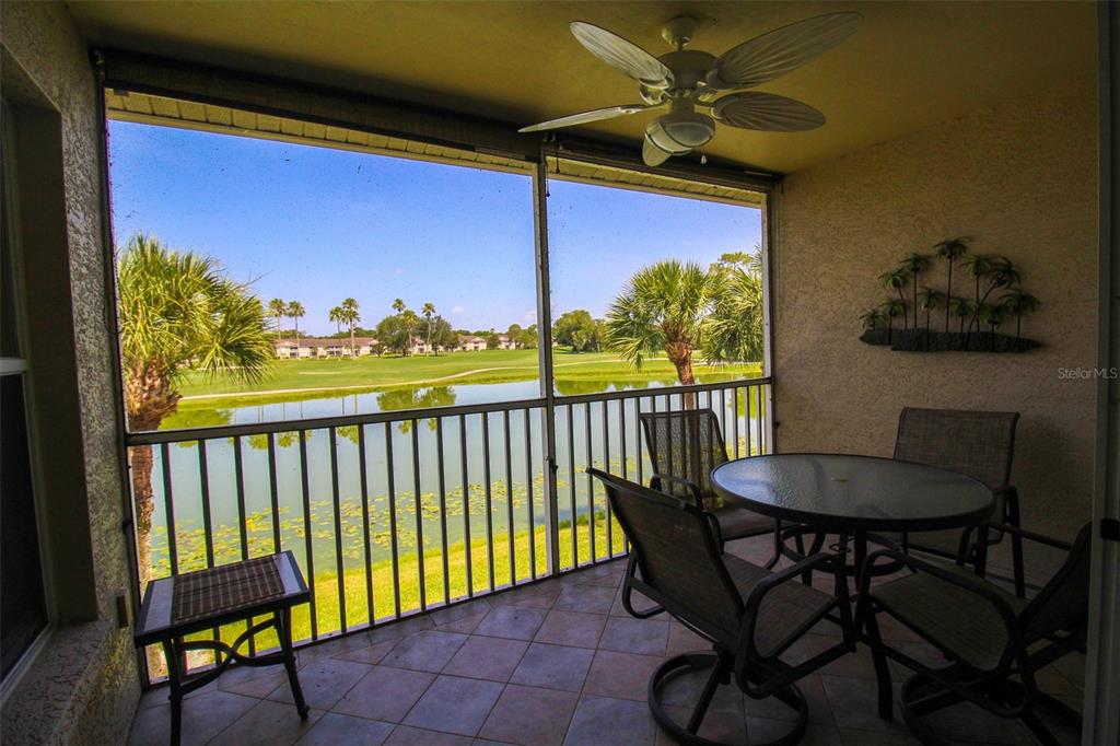 5301 Mahogany Run Avenue, Unit 1023 Sarasota, FL 34241 - Photo 49 of 56 a view of a chairs and table in patio