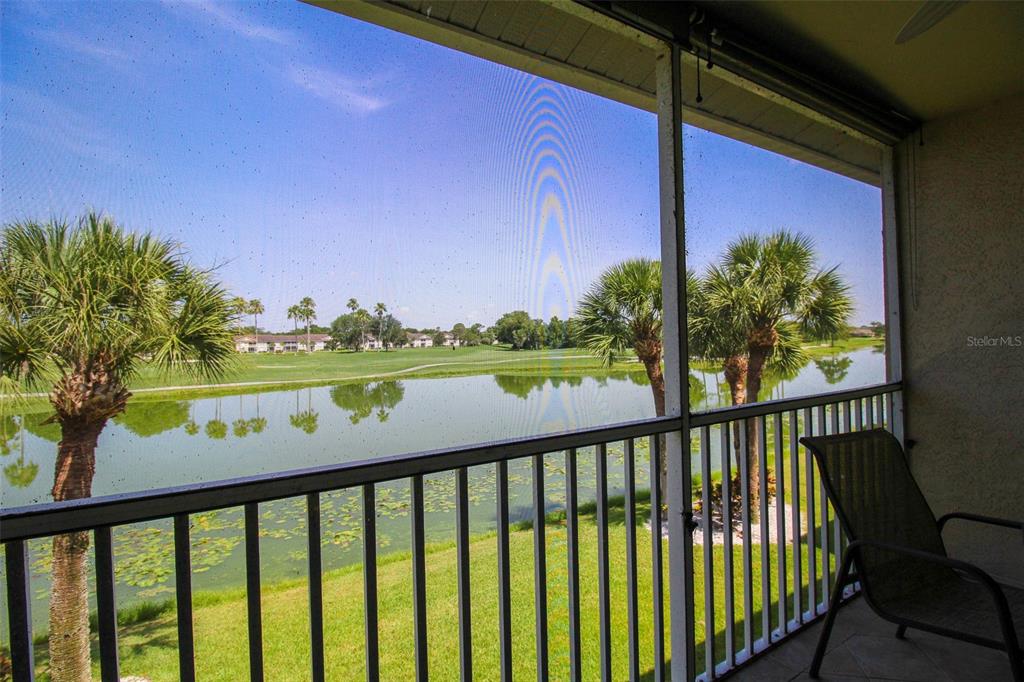 5301 Mahogany Run Avenue, Unit 1023 Sarasota, FL 34241 - Photo 50 of 56 a view of a balcony with flower plants