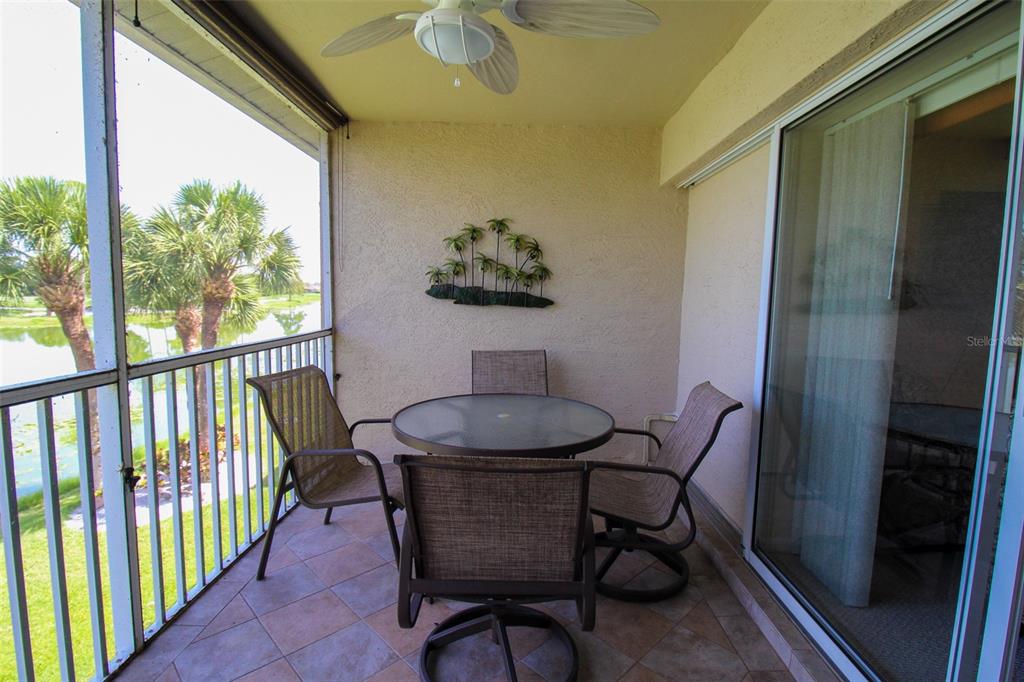 5301 Mahogany Run Avenue, Unit 1023 Sarasota, FL 34241 - Photo 52 of 56 a dining room with furniture and window
