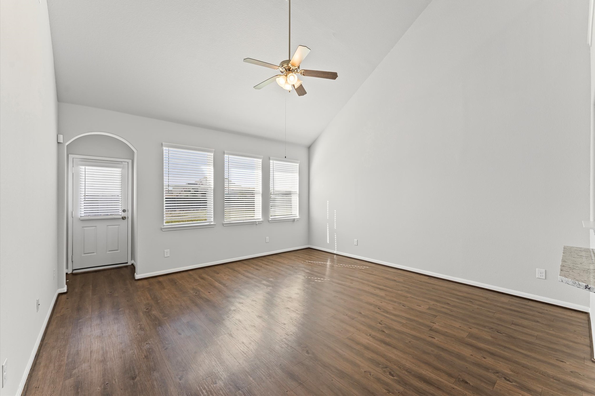 15207 Lake Erie Drive Humble, TX 77396 - Photo 13 of 37 an empty room with wooden floor fan and windows