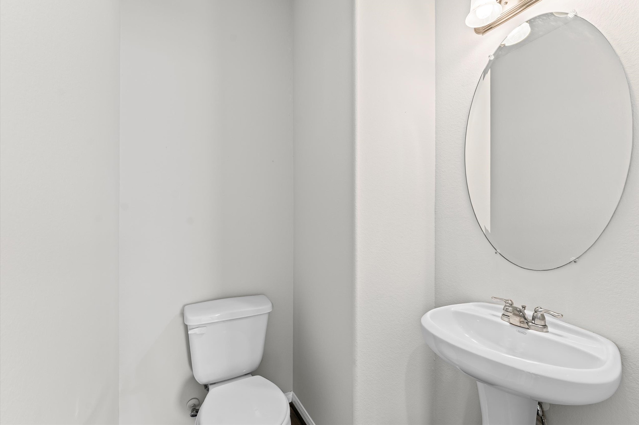 15207 Lake Erie Drive Humble, TX 77396 - Photo 14 of 37 a bathroom with a toilet sink and mirror
