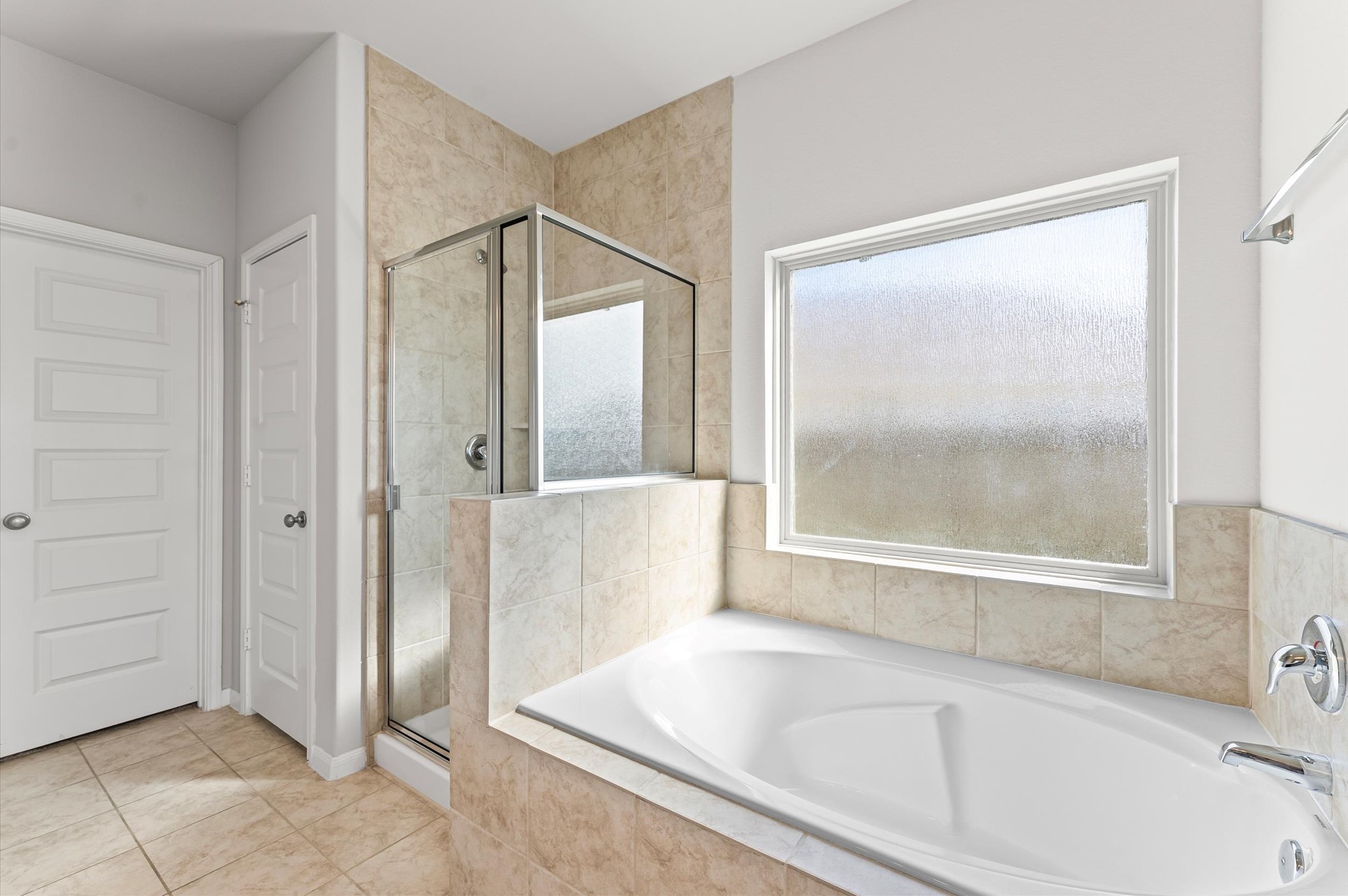 15207 Lake Erie Drive Humble, TX 77396 - Photo 17 of 37 a bathroom with a bathtub and a shower