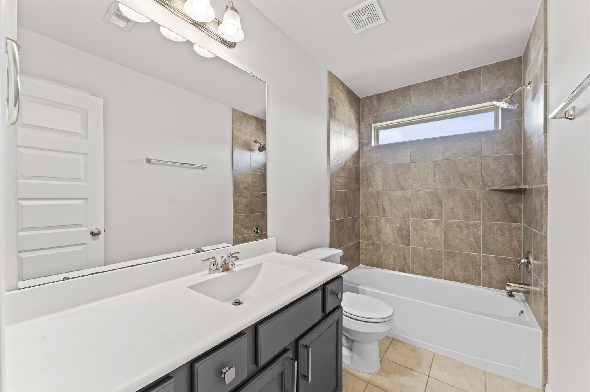 15207 Lake Erie Drive Humble, TX 77396 - Photo 23 of 37 a bathroom with a sink a toilet a mirror and shower