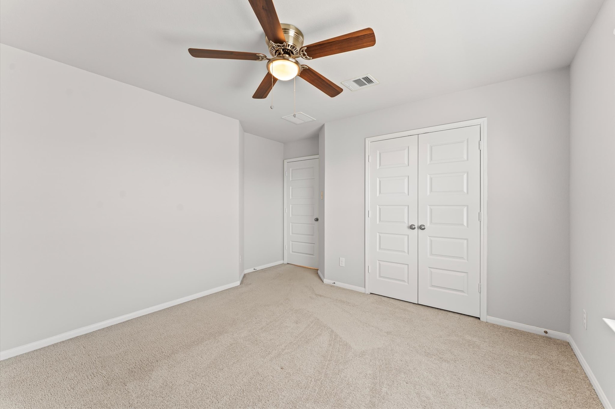 15207 Lake Erie Drive Humble, TX 77396 - Photo 28 of 37 an empty room with chandelier fan
