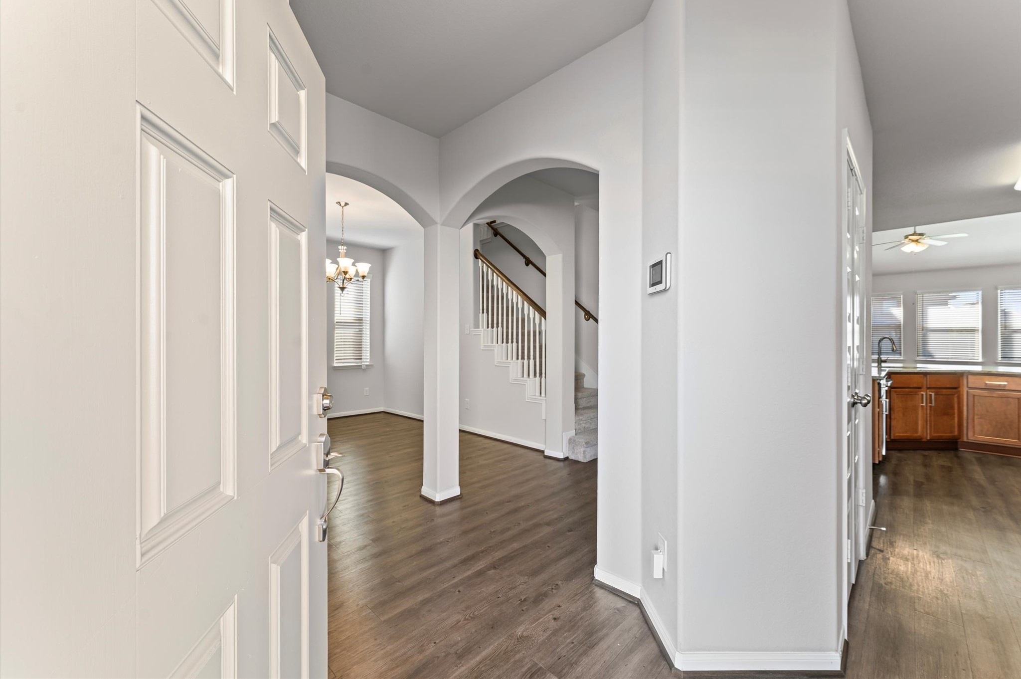15207 Lake Erie Drive Humble, TX 77396 - Photo 3 of 37 a view of a hallway with wooden floor and dining room
