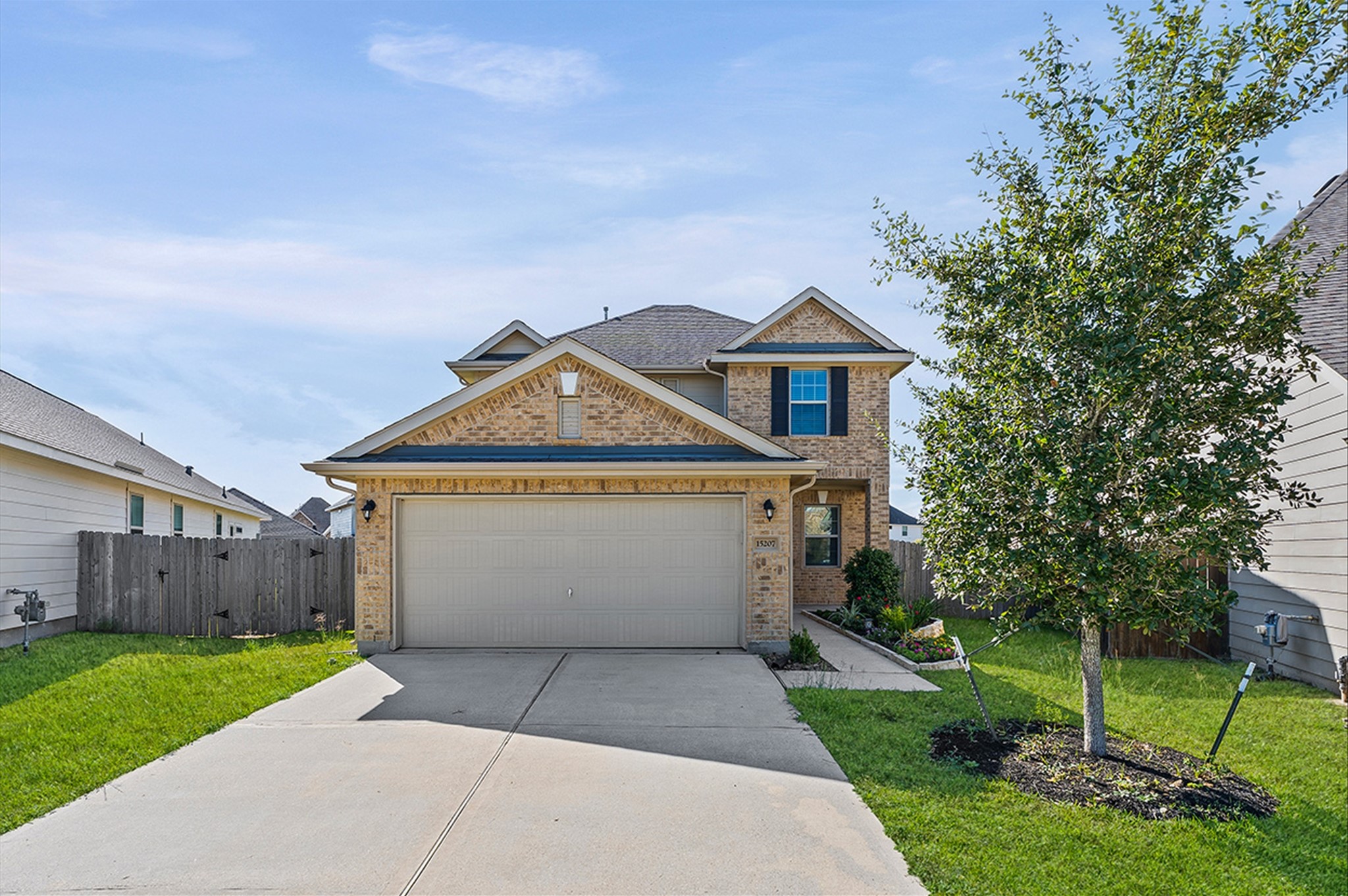 15207 Lake Erie Drive Humble, TX 77396 - Photo 32 of 37 a front view of a house with a yard and garage
