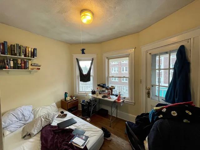 a bed room with furniture and a window