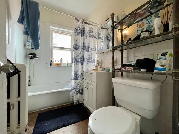 a bathroom with a toilet a sink and a bathtub