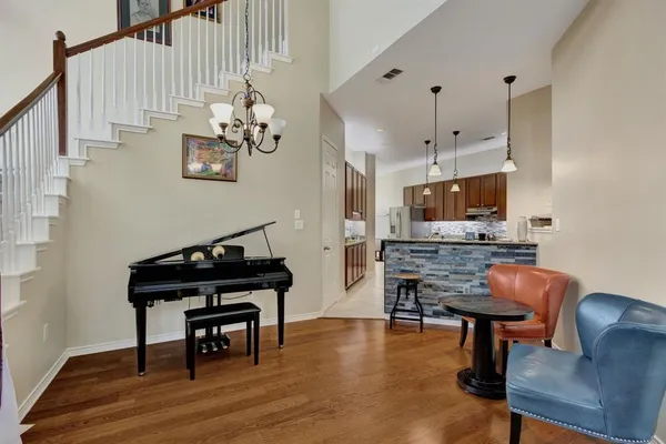 a living room with furniture fireplace and flat screen tv