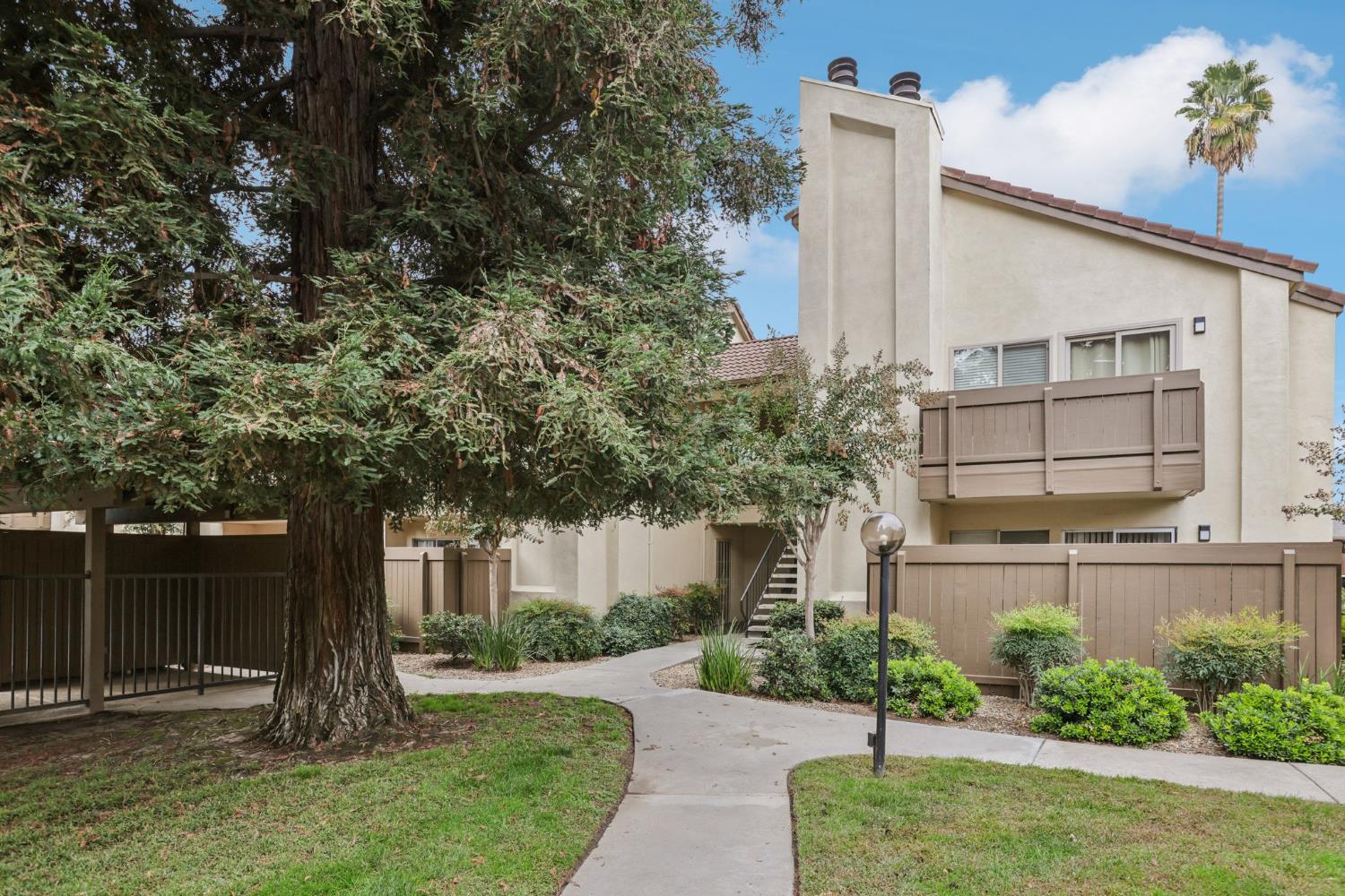 3700 Tully Road, Unit 57 Modesto, CA 95356 - Photo 22 of 34 a front view of a house with garden