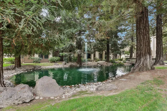 a body of water with a building in the background